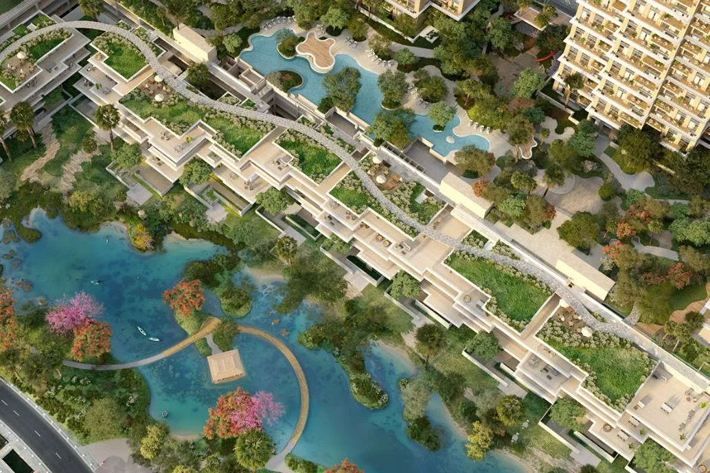 Overhead view of the lake, terraced townhouses and podium pool